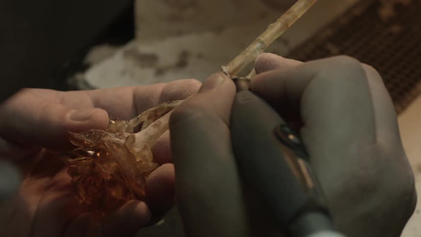 Person carving an ornament