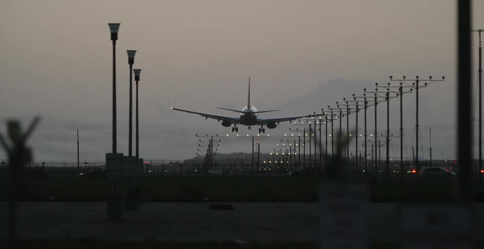 A plane lands at an airport