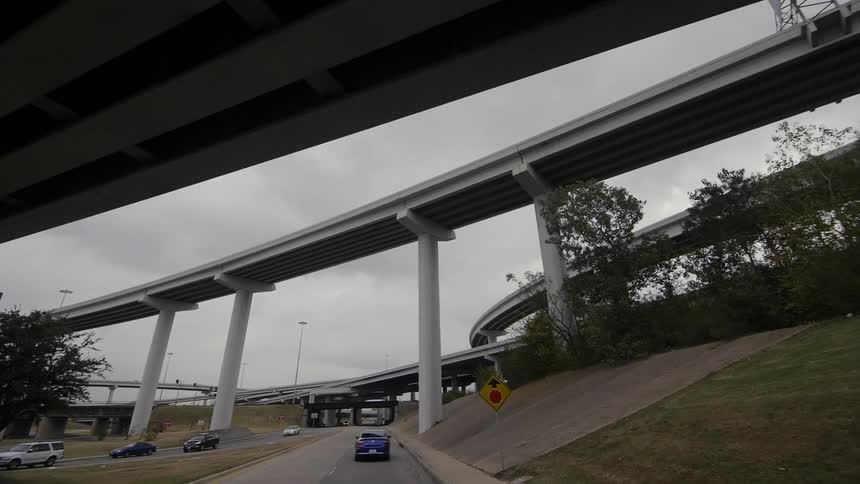 Traveling view on a highway going under a bridge