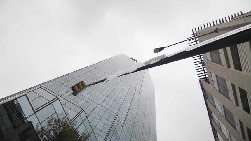 View looking up at skyscrapers on a cloudy day