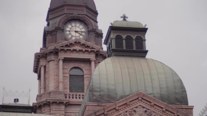 View of city buildings and a clock in the tower