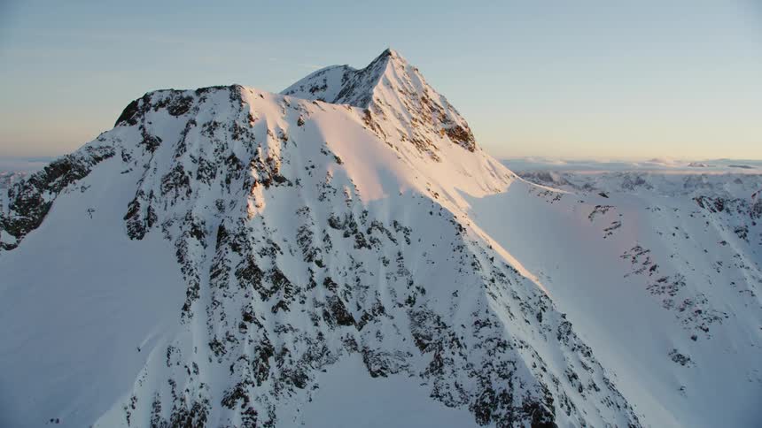 View of snowy mountains at sunset