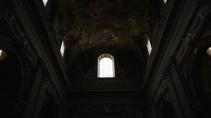 Light shines through a window in a church