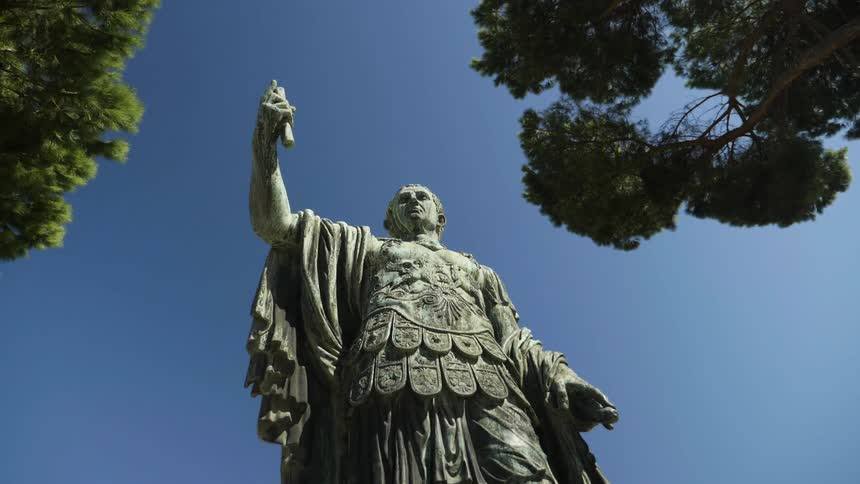 View of a statue of a person outside by trees