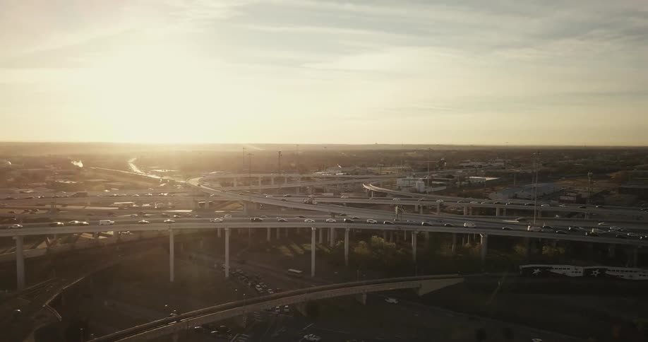Traffic travels on highway over passes and loops