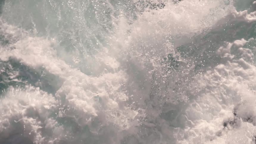 Water splashing to shore on a sunny day