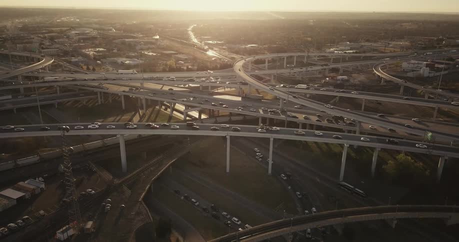 Cars drive on a city highway system