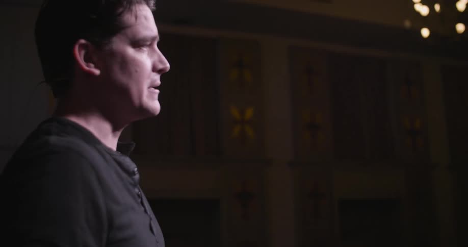 A man is giving a passion speech on stage
