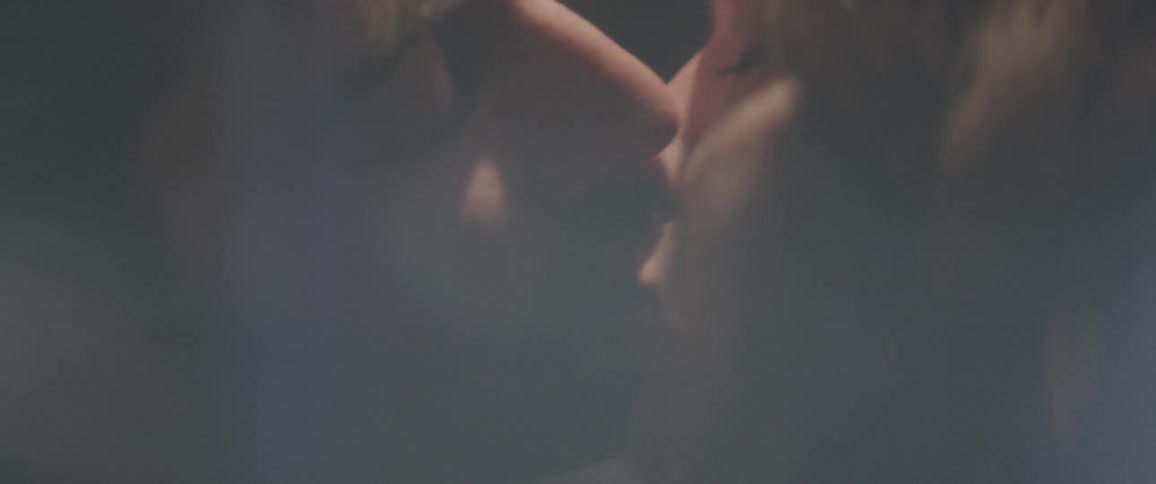 A man and woman kiss