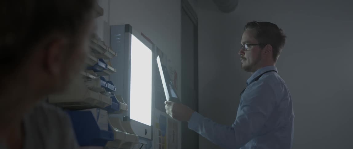 A doctor examines an x-ray