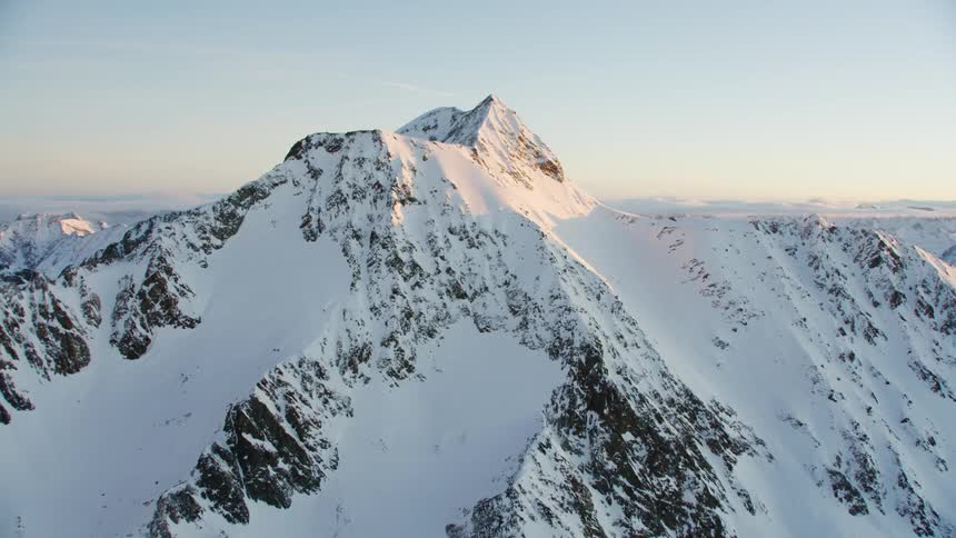 View of snowy mountains at sunset