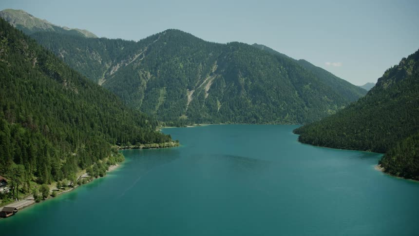 The water is blue in this lake between the mountains