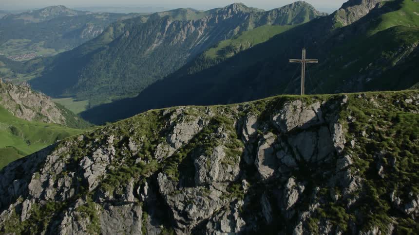 A cross is on the peak of this mountain