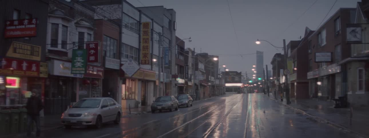 The street is empty with all the shops closed for the night