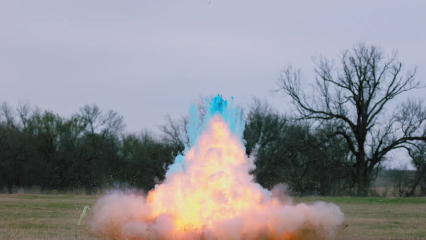 An explosion on the field gives off blue and fire