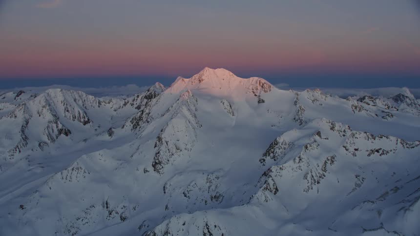 View of snowy mountains at sunset