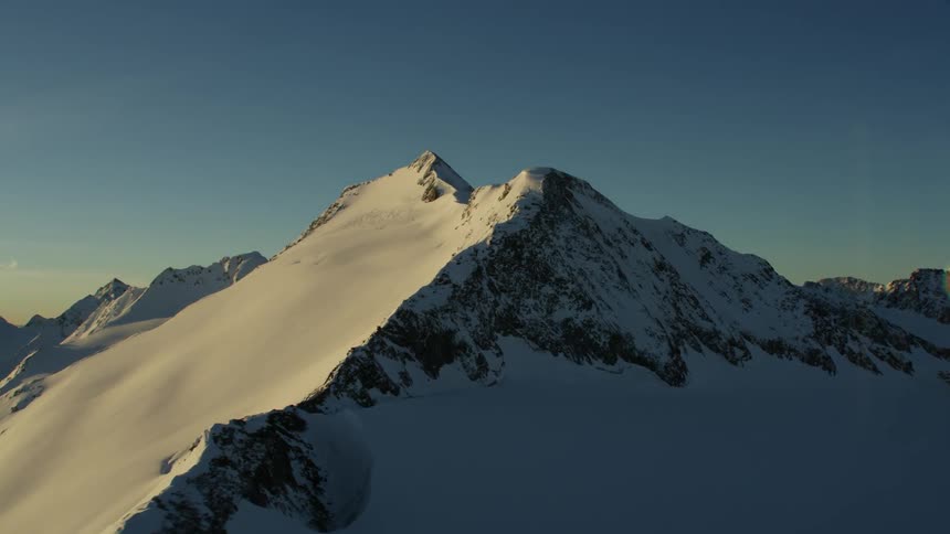 View of snowy mountains on a sunny day