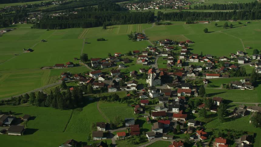 A small mountain community is shown on a sunny day
