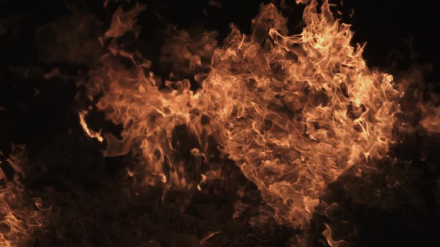 A fire sends up orange flames