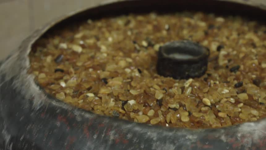 Pebbles are being churned in a vat