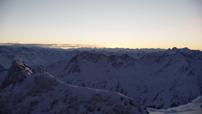 View of snowy mountains at sunset