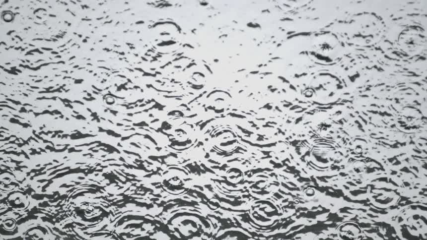 View of water droplets landing in a pool