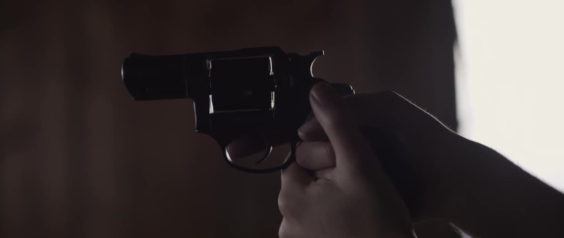 A man holding a revolver