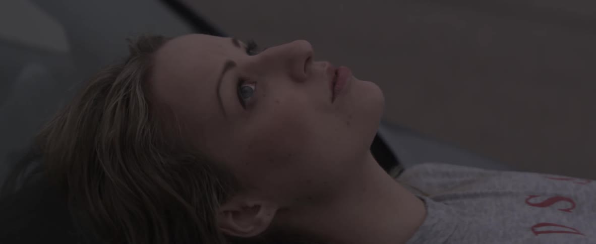 A woman is resting laying down