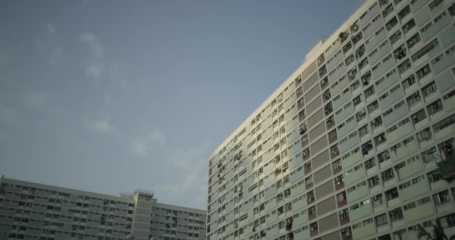 The tall buildings fill the clear sky