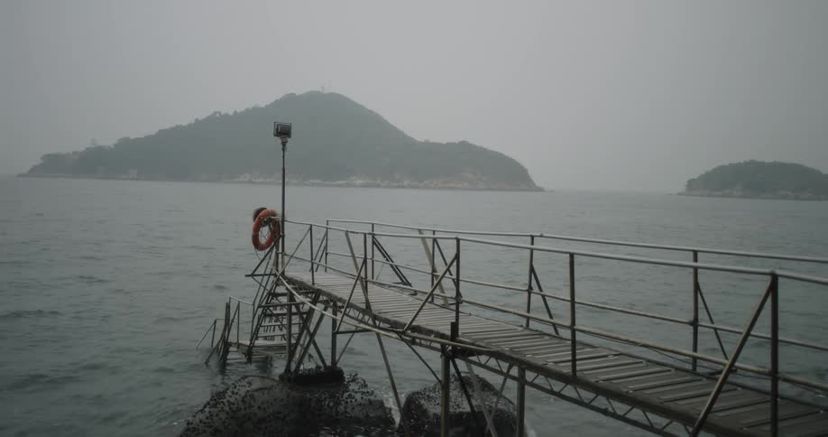 Ocean water ripples and flows around a pier