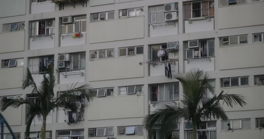 The building has many windows with fans