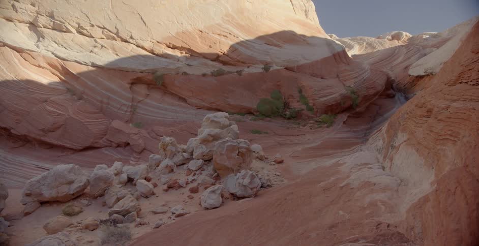 A red rock formation stands in the desert