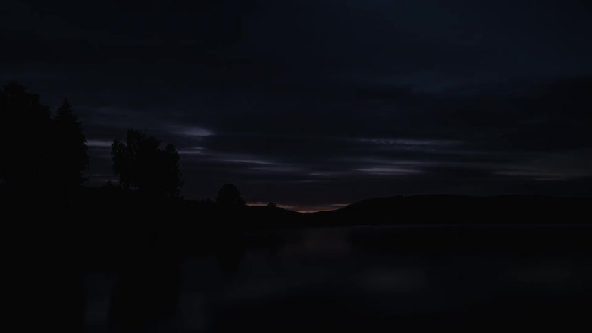 Sunset by a lake fades to black