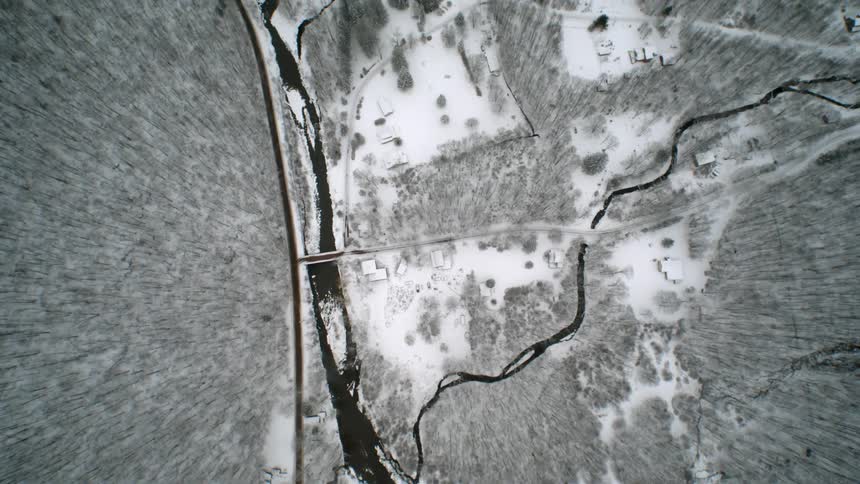 The creek runs through the icy terrain below