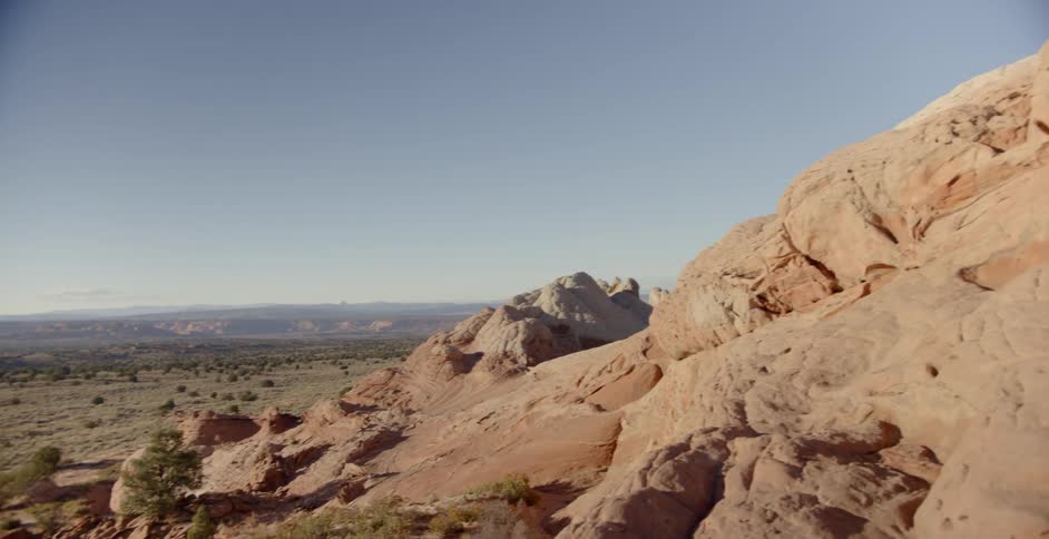 The canyon sits under a sunny sky