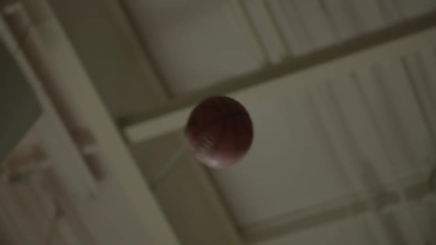A basketball is shot into the air
