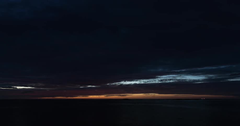 Sunset by the sea turning into night