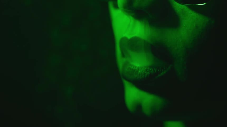 A woman smokes a cigarette