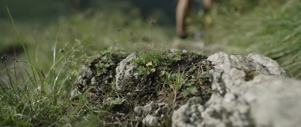A man runs over the rocks