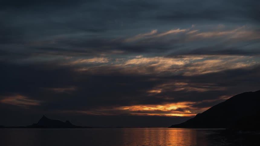 Sunset fades to black by the sea