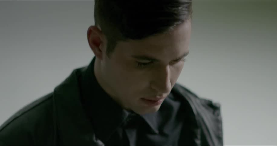 A man stands in a white flashing room
