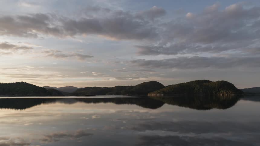 The morning lake is calm and peaceful