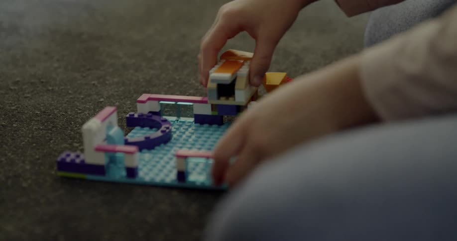 A child plays and builds with lego blocks