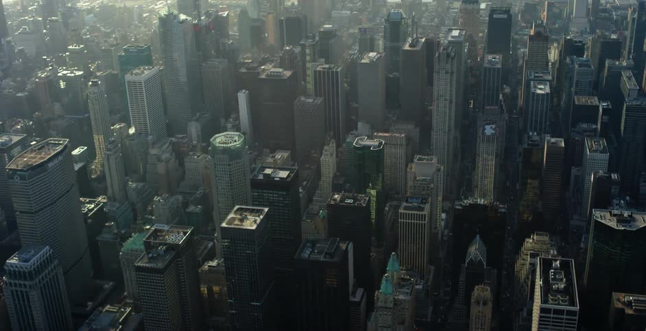 Aerial view of a hazy city of tall buildings