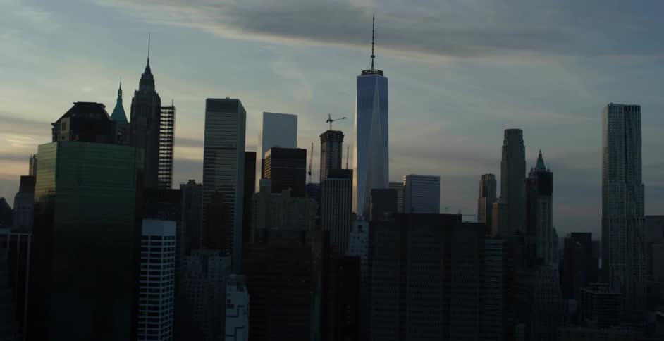 Aerial view of the tops of many tall buildings on a cloudy day