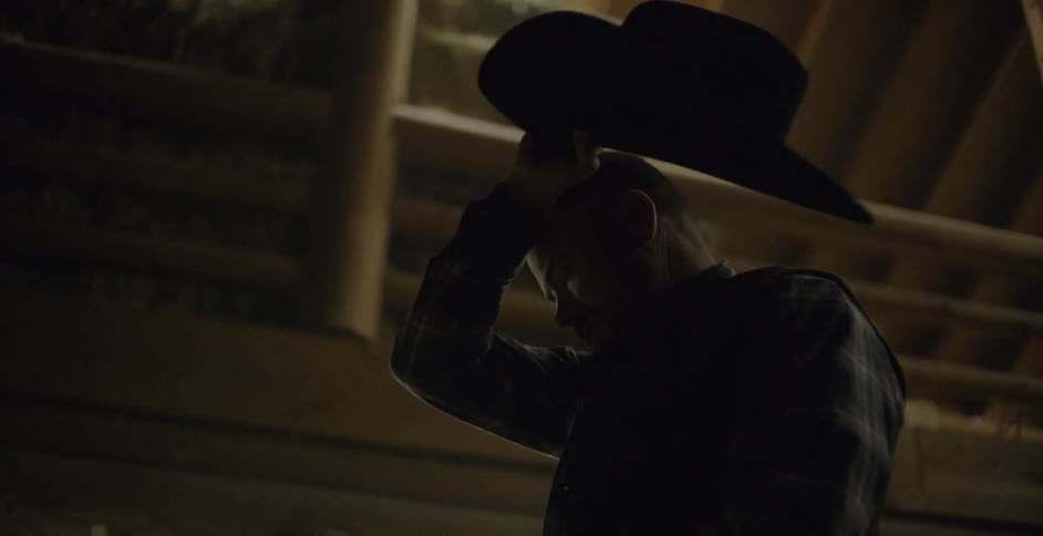 A man pulls off his hat and wipes his head