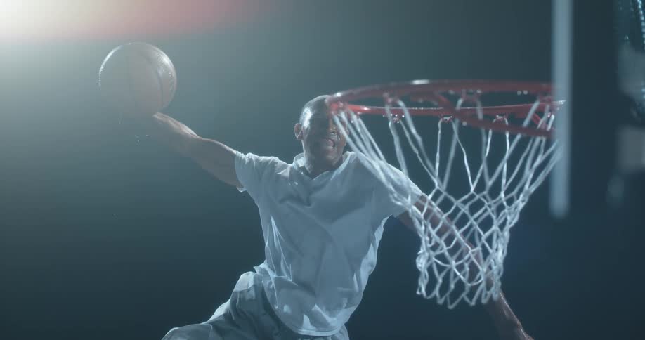 Man jumping up to dunk a basketball