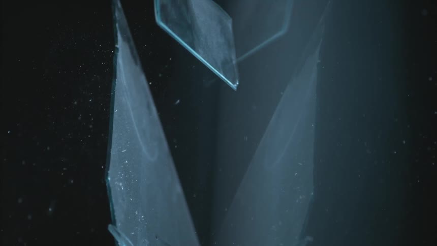 A basketball shatters glass