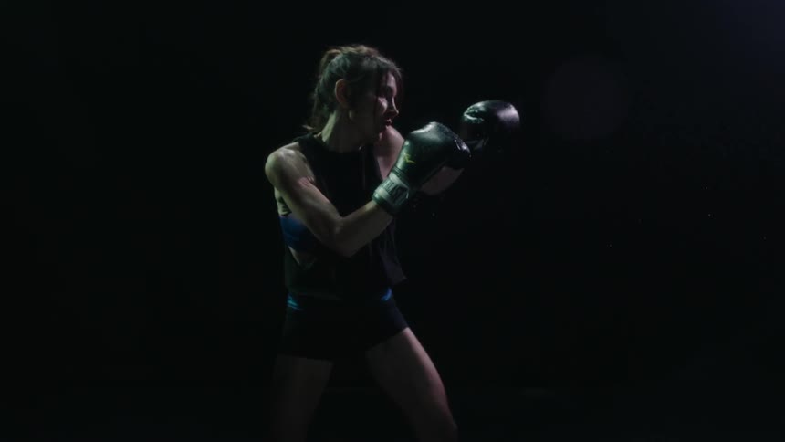 Woman boxing into thin air