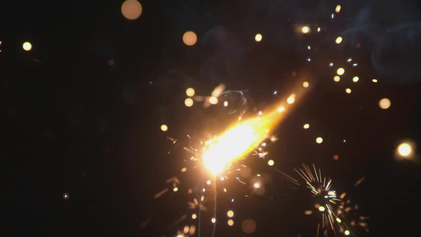 A lit sparkler sparking